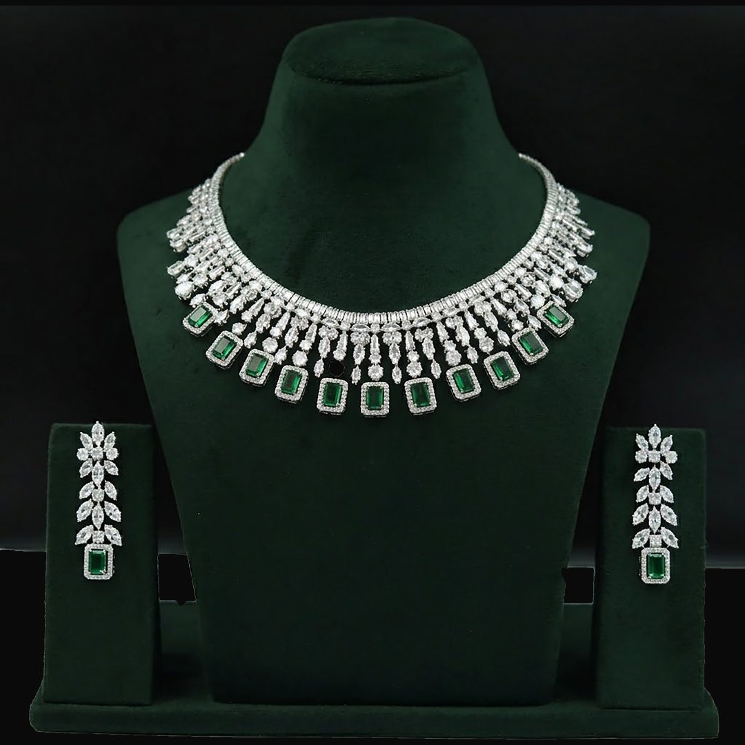 This luxurious set features simulated emeralds and diamonds.